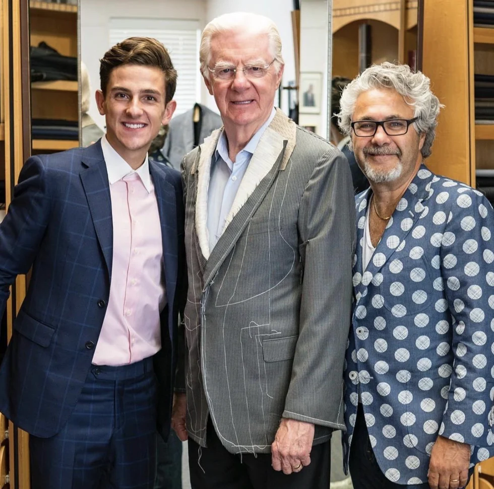 Matt Grybel with Bob Proctor and his tailor at the fitting for his first custom suit, Toronto