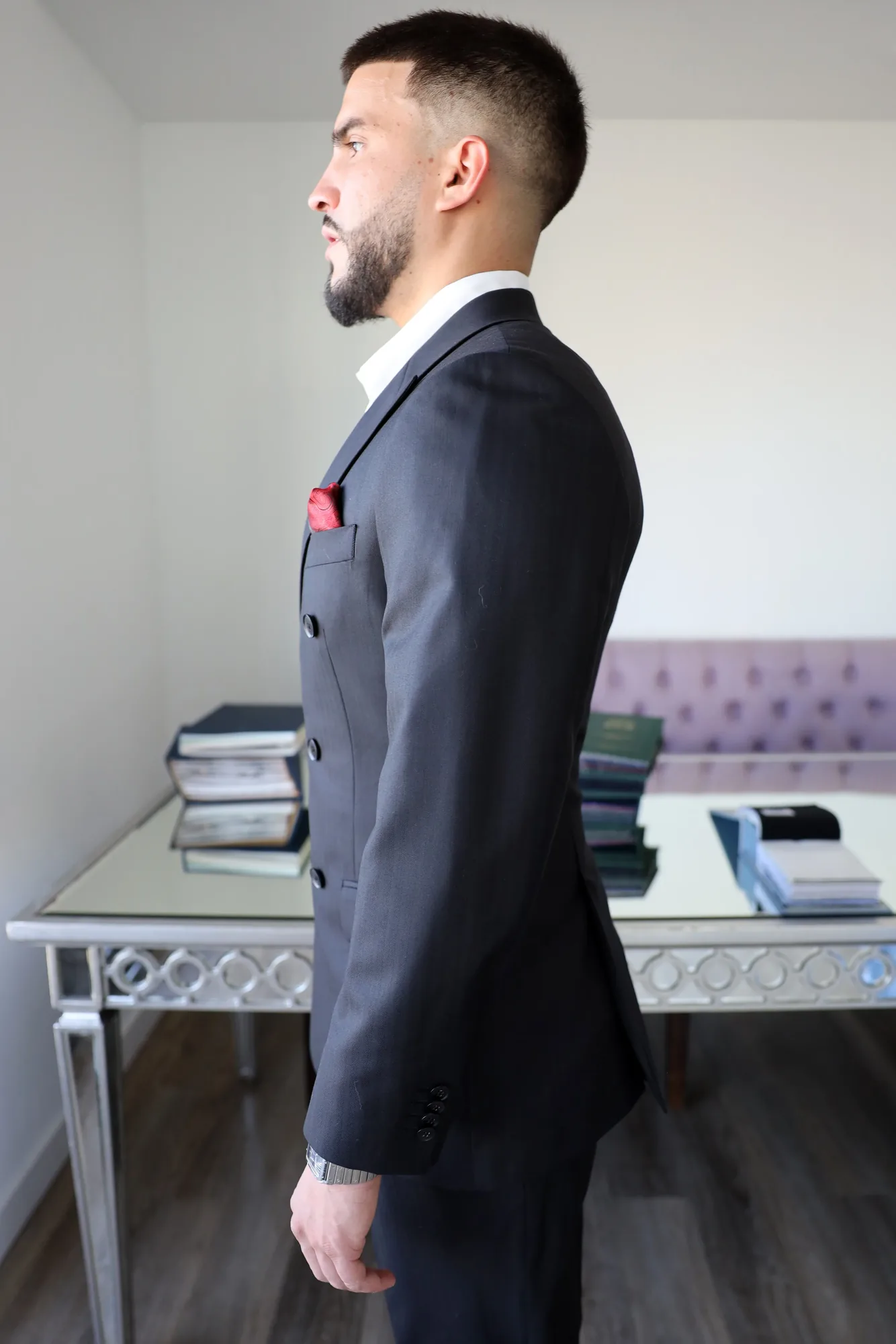 Black Ariston double-breasted, side profile showing the shoulder line