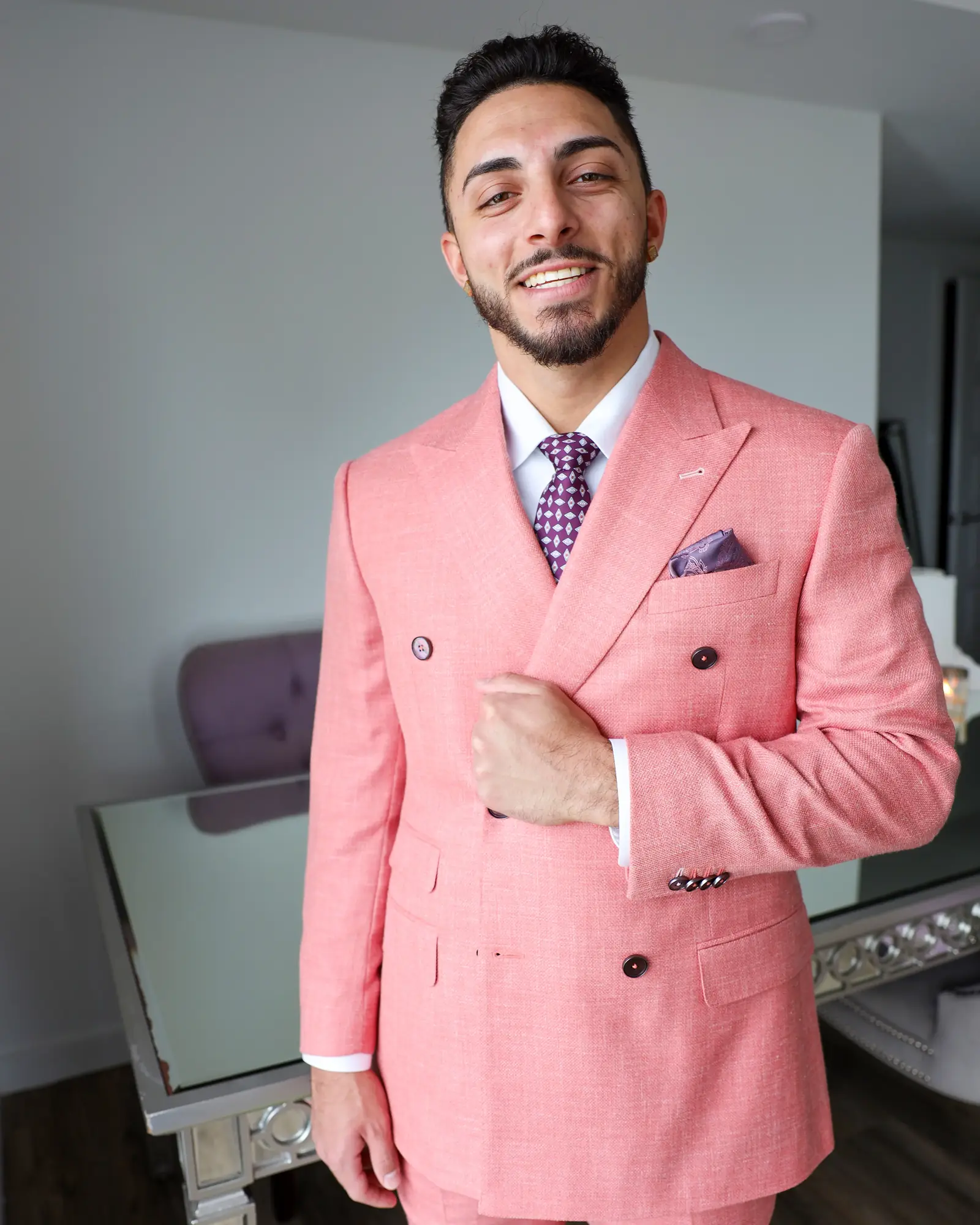 Michael DiPreta adjusting the cuff of the mauve pink Drago Sunlit jacket